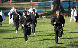 Martial artist training cardio at park training session outdoor